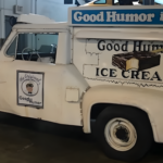 Vintage Good Humor ice cream truck parked indoors.